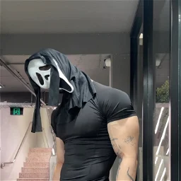 Green double couch with wooden legs